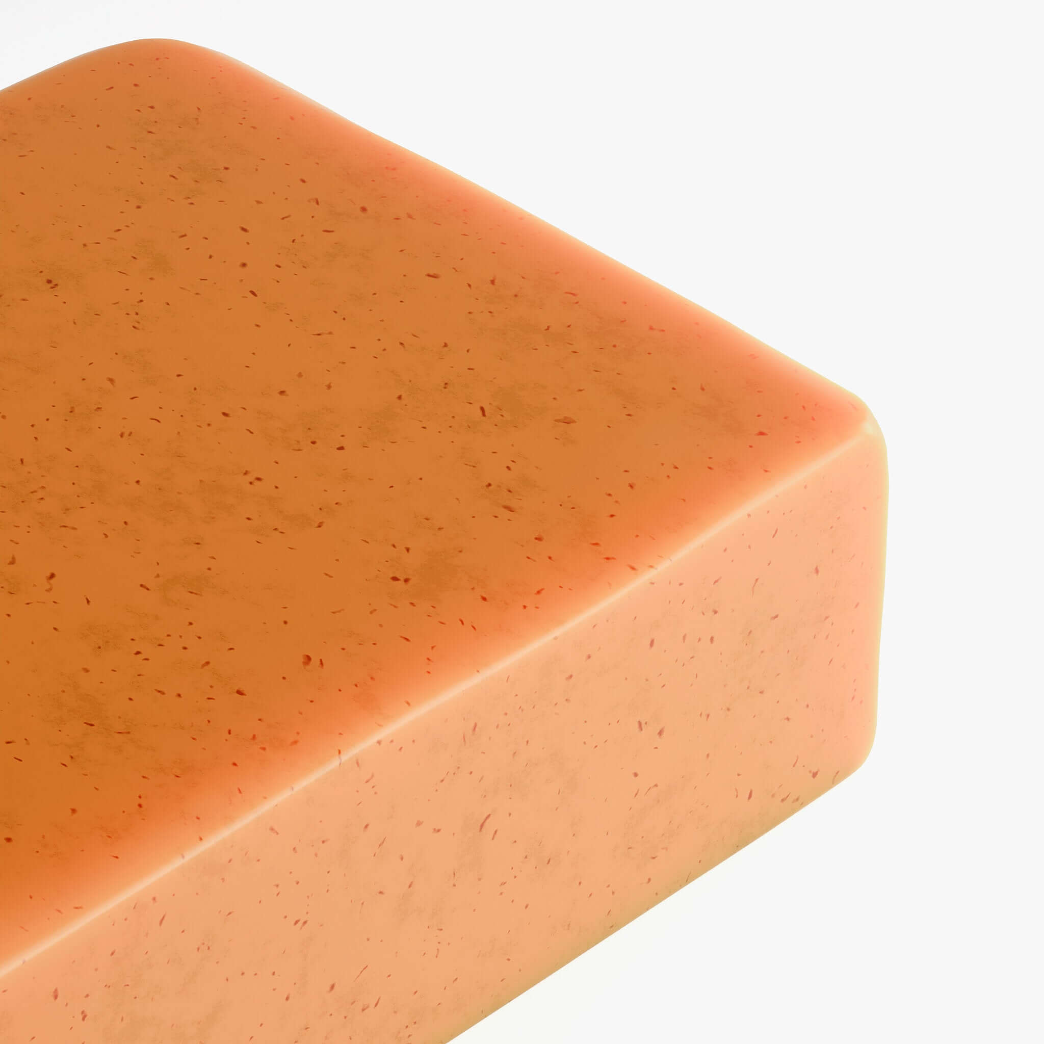 Kojic Acid & Turmeric Soap Bundle - close-up view of a soap bar highlighting the orange color and texture.