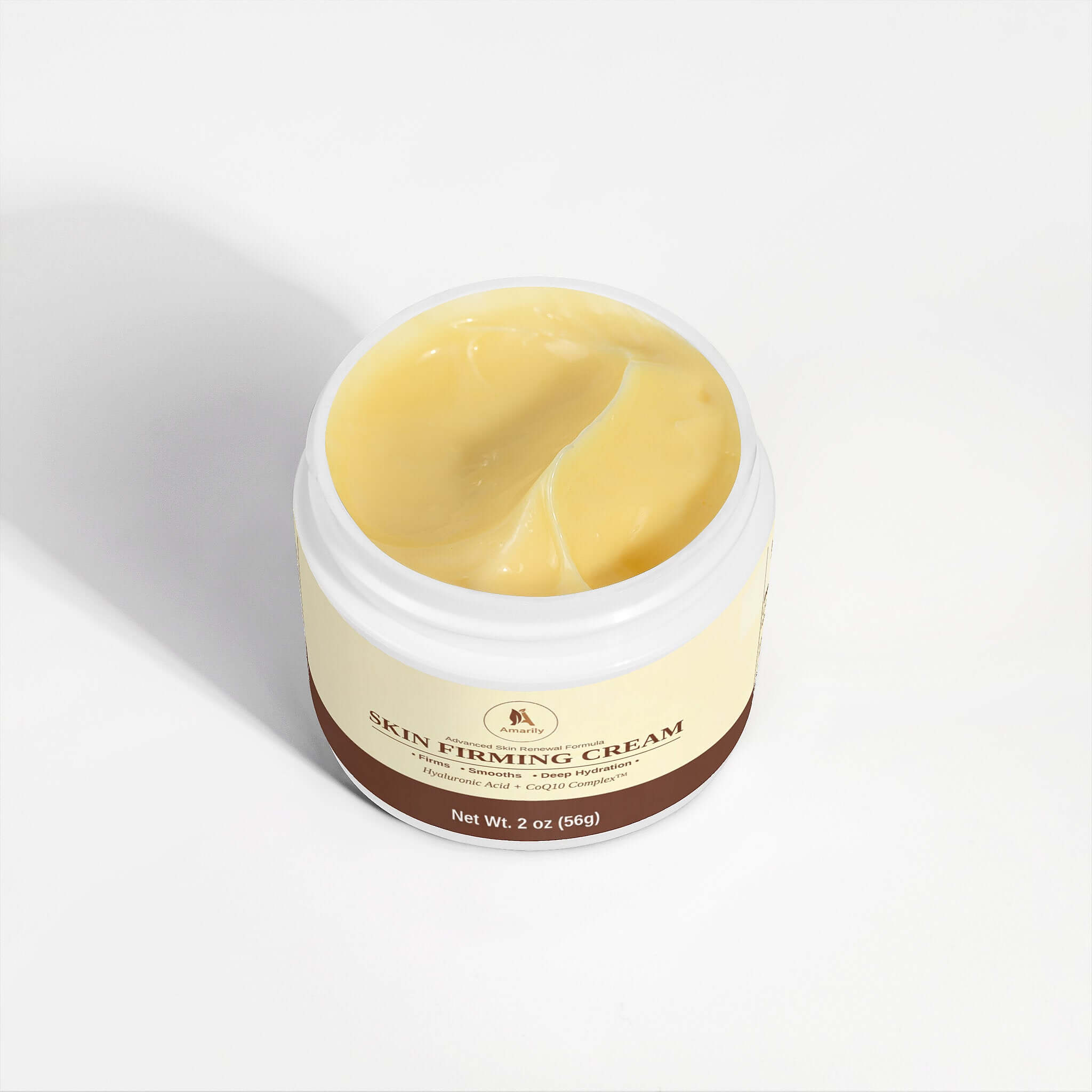 Hand applying Skin Firming Cream from an open jar